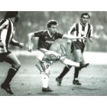 Mark Ward signed 8x10 b/w photo pictured in action for West Ham Utd. Good Condition. We combine