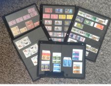 GB stamp collection on stock card. 8 pages. Unmounted mint covering 1960-1965. Cat value £100.
