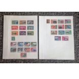 Dominican, Trinidad and Tobago and British Virgin Islands stamp collection on album page. 19 stamps.