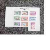 British Honduras mint stamp collection on album page. 9 stamps. Good Condition. We combine postage