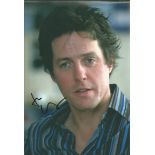 Hugh Grant signed 8x12 colour photo. British actor and film producer has received a Golden Globe,