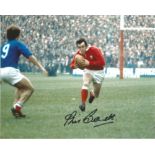 Phil Bennett signed 10x8 colour action shot photo playing for Wales against France in the Five
