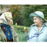 Sylvia Syms as Queen Mother signed 10 x 8 colour photo. Good Condition. We combine postage on