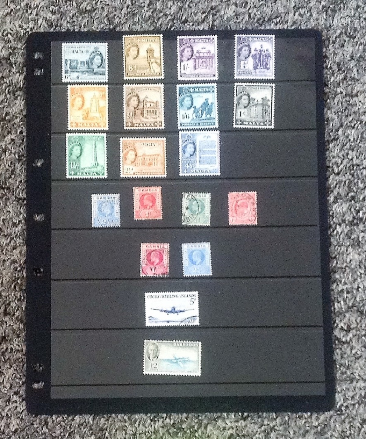 Worldwide stamp collection 1 album leave includes 19 stamps from Malta, Gambia, Cocos Keeling