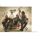 The Coral Fully Signed Band 8x10 Photo. Good Condition. We combine postage on multiple winning