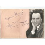 Ken Dodd signed album page with black and white photo attached. Good Condition. We combine postage