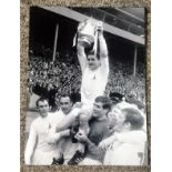 Dave Mackay signed 16x12 black and white photo. Celebrating with Spurs. Good Condition. We combine