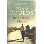 In the Wolf's Mouth by Adam Foulds paperback book. A war novel, detailing the dark horrors of war.
