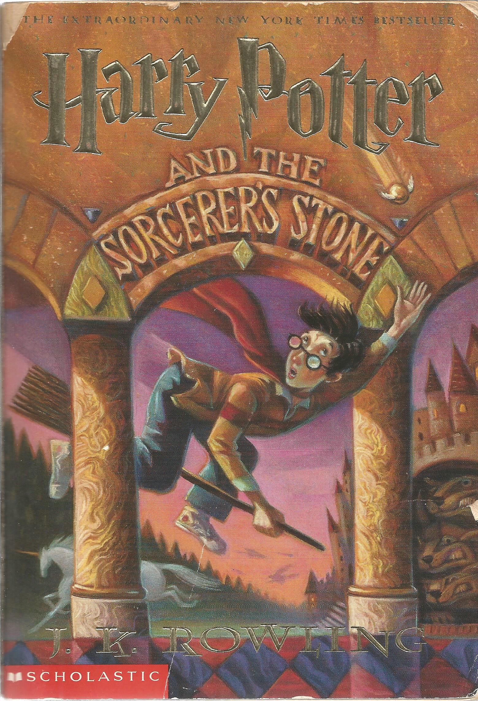 Harry Potter and the Sorcerer's Stone by J. K. Rowling. Paperback in OK condition, the cover has