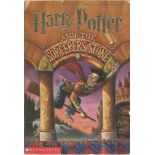 Harry Potter and the Sorcerer's Stone by J. K. Rowling. Paperback in OK condition, the cover has