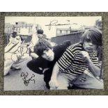 Stone Roses music band signed 16 x 12 b/w photo signed by all the four band members, scarce and very