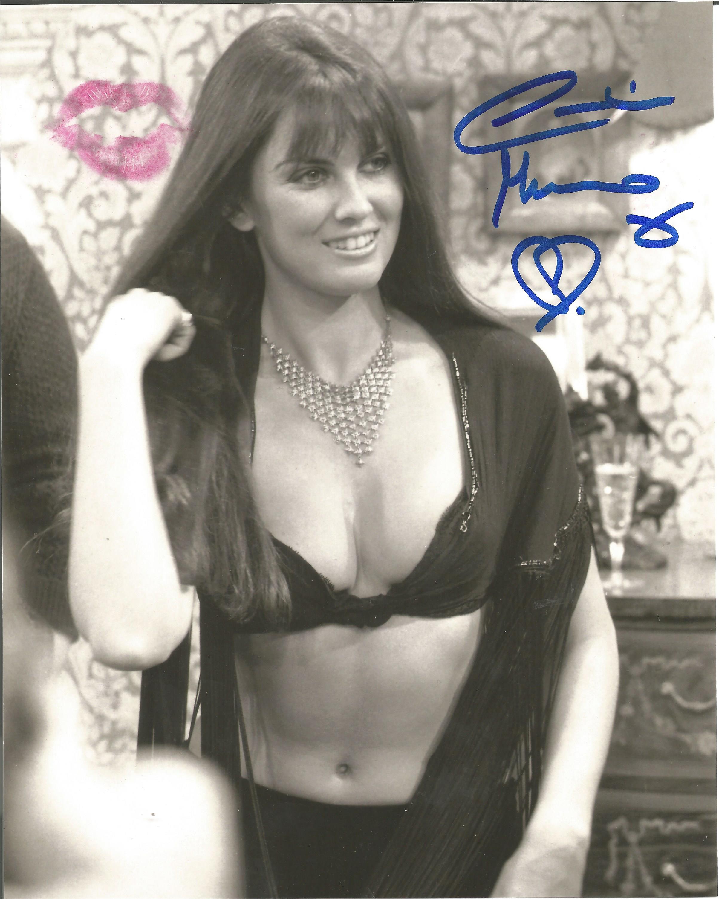 James Bond Caroline Munro signed sexy 10 x 8 b/w photo; she has added a kiss in pink lipstick to the