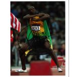 Usain Bolt Athletics Signed 10 x 8 inch sport photo. Good Condition. We combine postage on