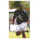 Dwight Yorke signed 10x8 colour photo pictured in action for Manchester United. Good Condition.