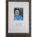 Graham Hill signature piece mounted below colour photo. (15 February 1929 - 29 November 1975) was