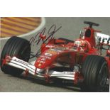 Michael Schumacher 12x8 signed colour photo pictured driving for Ferrari. Good Condition. All