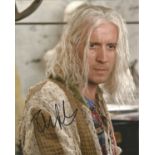 Rhys Ifans signed 10x8 colour photo. Good Condition. All autographs are genuine hand signed and come