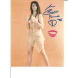 Caroline Munro signed 10x8 black and white photo. She has added a kiss in pink lipstick to photo.