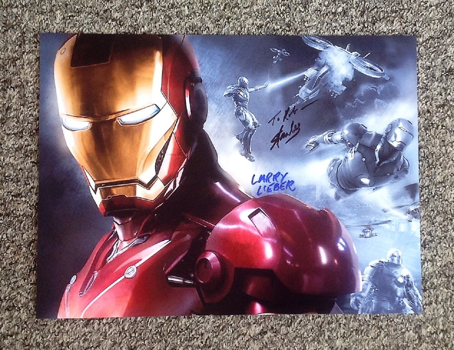 Marvel Iron Man 16x12 colour animation signed by creators Stan Lee and Larry Lieber. Good Condition.