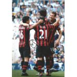 David Silva and Edin Dzeko signed 12x8 colour photo pictured celebrating while playing for