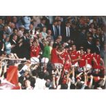 Man United Bryan Robson Signed 12 x 8 inch football colour photo. Supplied from stock of www.