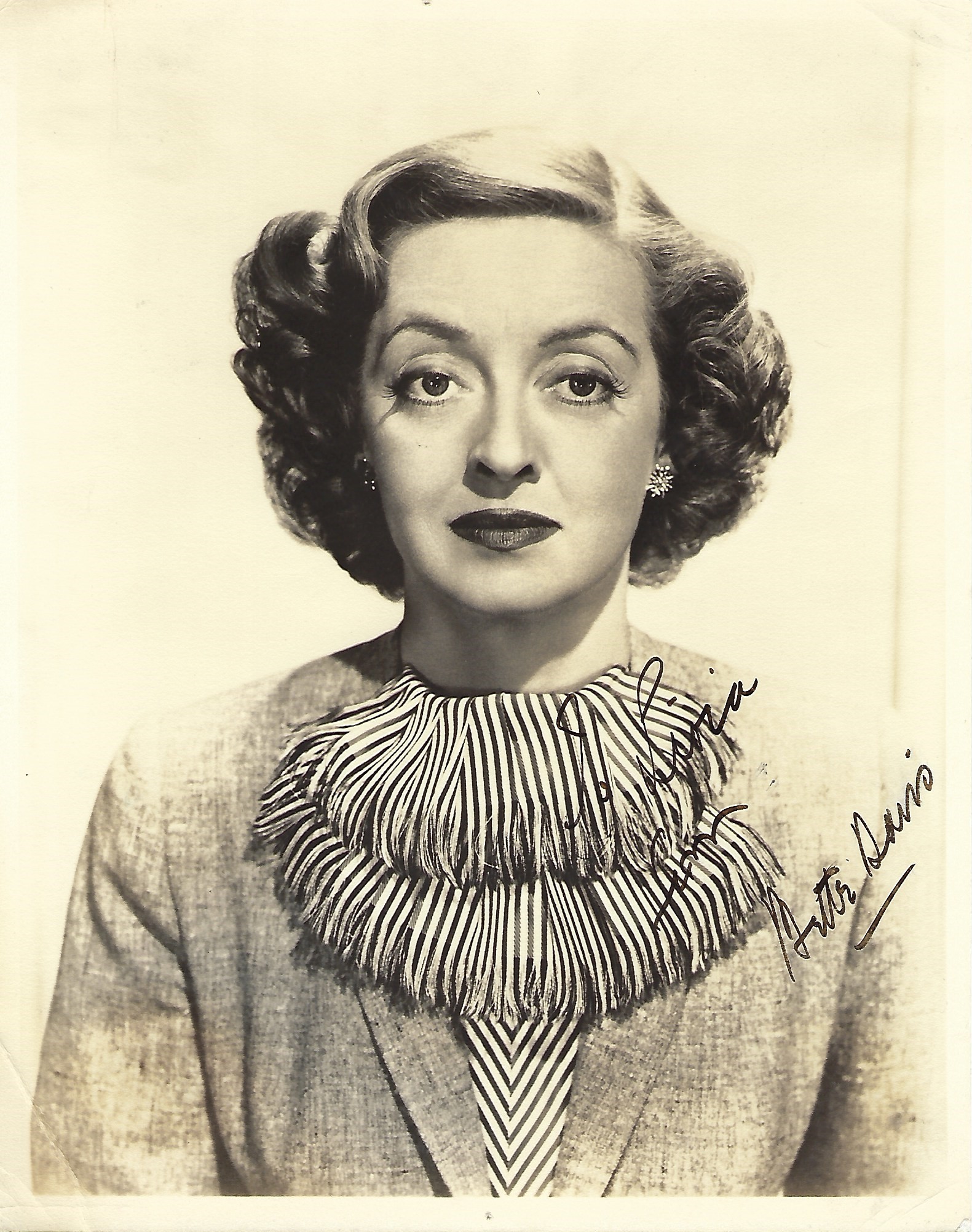 Bette Davis Signed photo black and white 10 x 8 inch. Dedicated Semi-legible personalisation.