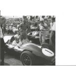 Stirling Moss signed 8 x 8 b/w photo to Doug. Good Condition. All autographed items are genuine hand