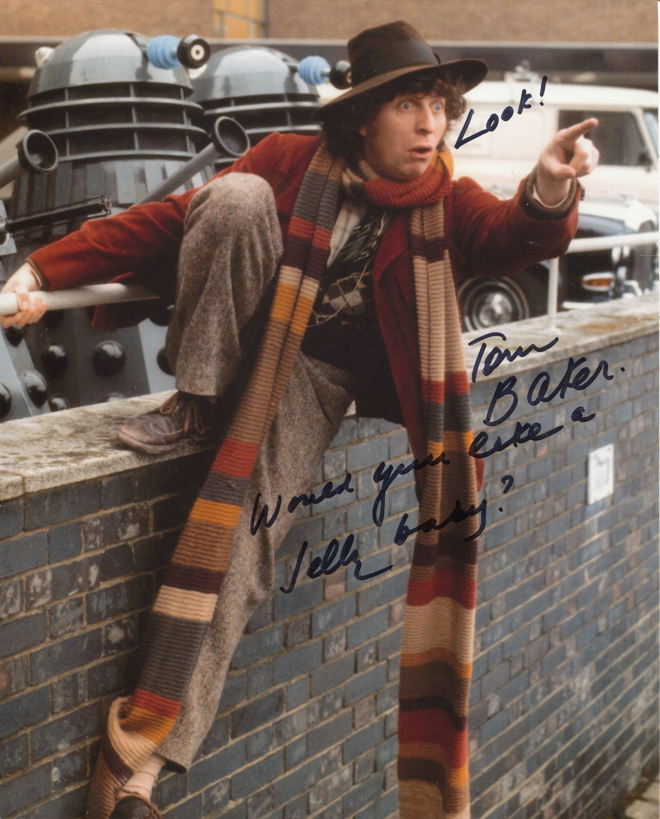 DOCTOR WHO 8x10 scene photo signed by actor Tom Baker as the Time Lord himself. Good Condition.