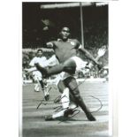 Eusebio Portugal Signed 12 x 8 inch football black and white photo. Good Condition. All signed