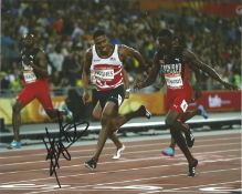 Athletics Zharnel Hughes 10x8 signed colour photo. Good Condition. All signed pieces come with a