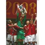 Football Edwin Van Der Sar signed 12x8 colour photo pictured lifting the Champions League Trophy