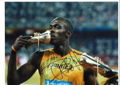 Athletics Usain Bolt Athletics Signed 16 x 12 inch sport photo. Good Condition. All signed pieces