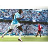 Football Yaya Toure signed 12x8 colour photo pictured celebrating while playing for Manchester City.