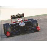 Formula 1 Vitaly Petrov Grand Prix racing driver signed Renault car in action photo. Comes with