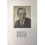 Melvyn Douglas signature piece mounted below black and white photo. Approx overall size 16x12.