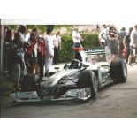 Formula 1 Nick Heidfeld Grand Prix racing driver signed Mercedes car in action photo. Comes with COA