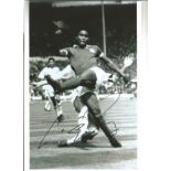 Eusebio football legend signed 12 x 8 inch b/w action photo. Good Condition. All signed pieces
