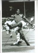 Eusebio football legend signed 12 x 8 inch b/w action photo. Good Condition. All signed pieces