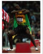 Usain Bolt Athletics Signed 10 x 8 inch sport photo. Good Condition. All signed pieces come with a