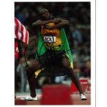 Usain Bolt Athletics Signed 10 x 8 inch sport photo. Good Condition. All signed pieces come with a