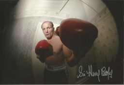 Sir Henry Cooper Signed 12 x 8 inch boxing photo. Good Condition. All signed pieces come with a