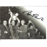 Bobby Charlton signed 6 x 4 inch b/w photo holding the European cup. Good Condition. All signed