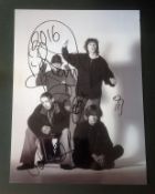 Stone Roses music band signed 16 x 12 b/w photo signed by all the four band members, scarce and very