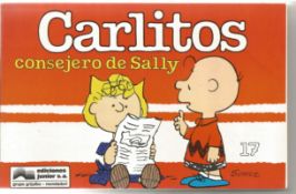 Charles Shultz signed with Doodle to Andrew inside Carlito's Consejero de Sally book. This is in