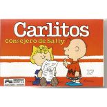 Charles Shultz signed with Doodle to Andrew inside Carlito's Consejero de Sally book. This is in