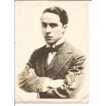 Charles Chaplin signed 7 x 5 sepia portrait photo of a young Chaplin with bow tie and tense look.