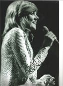 Cilla Black signed 12 x 8 b/w photo singing on stage. Good Condition. All signed pieces come with