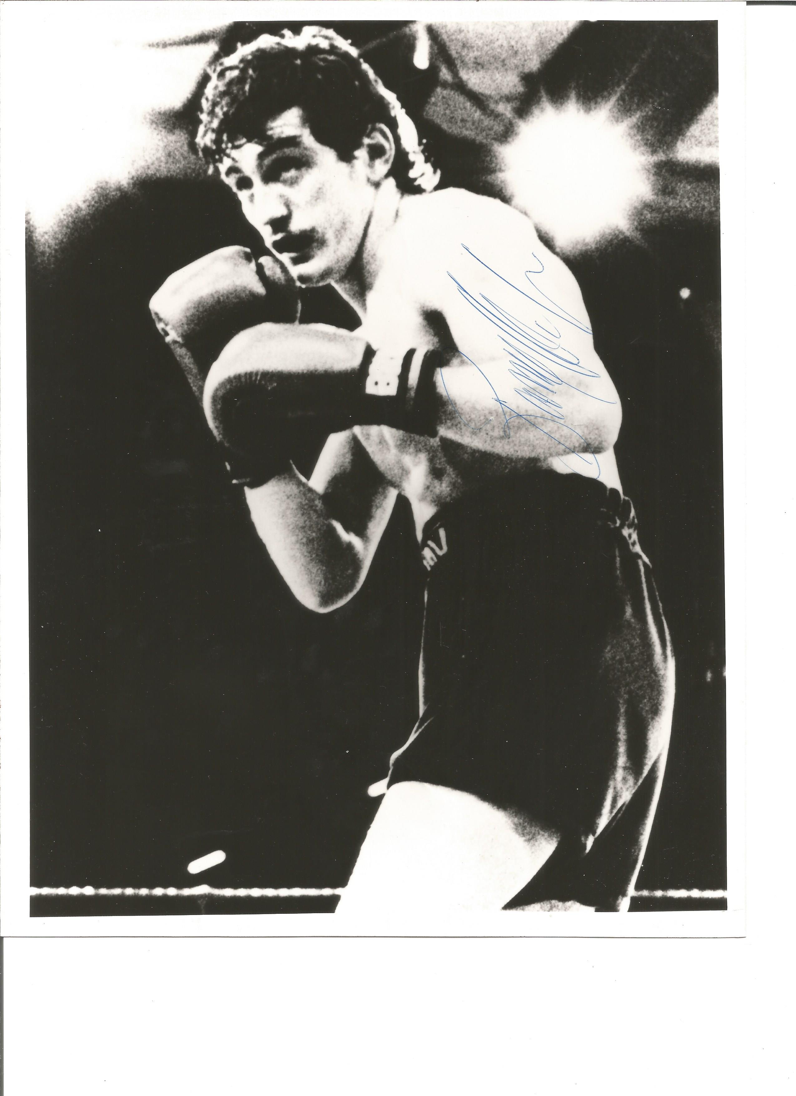 Barry Mcguigan signed 10x8 black and white photo. Good Condition. All signed pieces come with a
