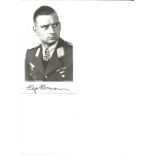 WW2 Luftwaffe fighter ace Hajo Herrmann KC signed 6 x 4 inch b/w portrait photo in uniform. Good