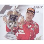 Sebastian Vettel signed 10 x 8 inch Motor Racing photo holding trophy. Good Condition. All signed